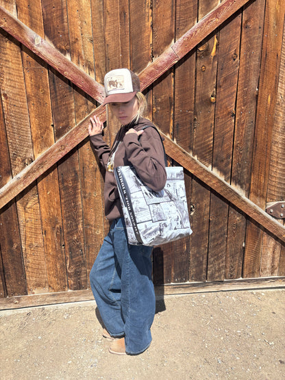 Canvas tote bag with the Settler's Goods mark