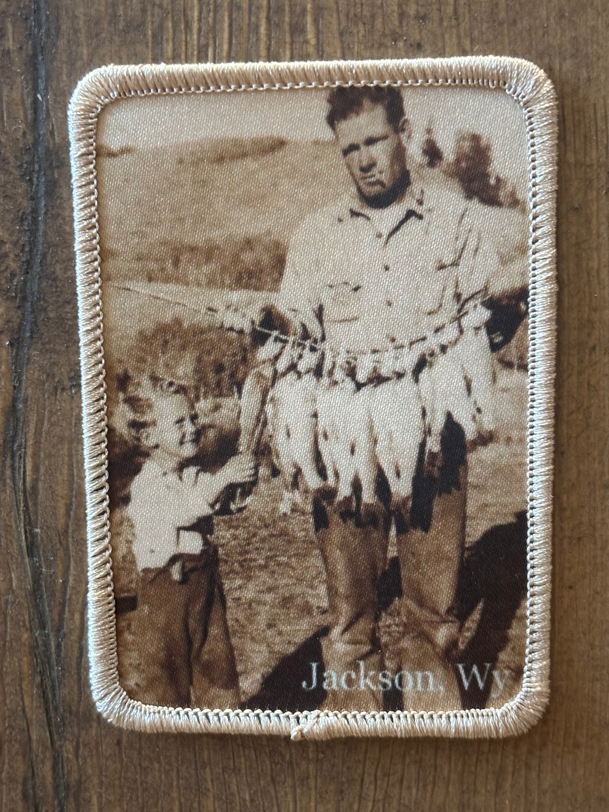 Patch showing a father and son with a stringer of trout on the Snake River
