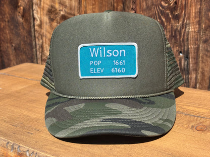 Trucker hat with a Wilson, Wyoming road sign patch